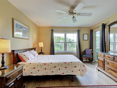 Enjoy peaceful canal views and Florida living at its finest in on Sabal Trace Golf and Country Club in Florida - for sale on GolfHomes.com, golf home, golf lot