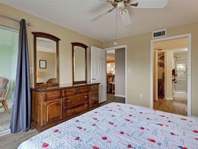 Enjoy peaceful canal views and Florida living at its finest in on Sabal Trace Golf and Country Club in Florida - for sale on GolfHomes.com, golf home, golf lot