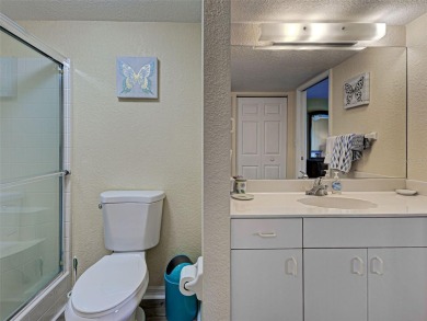 Enjoy peaceful canal views and Florida living at its finest in on Sabal Trace Golf and Country Club in Florida - for sale on GolfHomes.com, golf home, golf lot