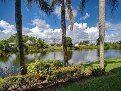 Enjoy peaceful canal views and Florida living at its finest in on Sabal Trace Golf and Country Club in Florida - for sale on GolfHomes.com, golf home, golf lot