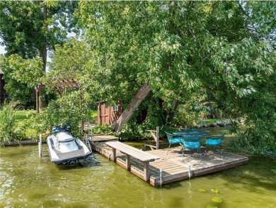 Spacious, scenic, and serene, this 4-bedroom, 3-bath lake house on Chomonix Golf Course in Minnesota - for sale on GolfHomes.com, golf home, golf lot