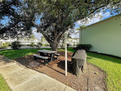 Enjoy peaceful canal views and Florida living at its finest in on Sabal Trace Golf and Country Club in Florida - for sale on GolfHomes.com, golf home, golf lot