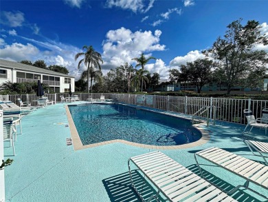 Enjoy peaceful canal views and Florida living at its finest in on Sabal Trace Golf and Country Club in Florida - for sale on GolfHomes.com, golf home, golf lot