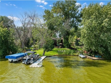 Spacious, scenic, and serene, this 4-bedroom, 3-bath lake house on Chomonix Golf Course in Minnesota - for sale on GolfHomes.com, golf home, golf lot