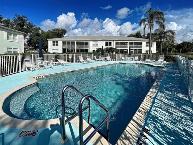 Enjoy peaceful canal views and Florida living at its finest in on Sabal Trace Golf and Country Club in Florida - for sale on GolfHomes.com, golf home, golf lot