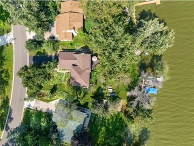 Spacious, scenic, and serene, this 4-bedroom, 3-bath lake house on Chomonix Golf Course in Minnesota - for sale on GolfHomes.com, golf home, golf lot