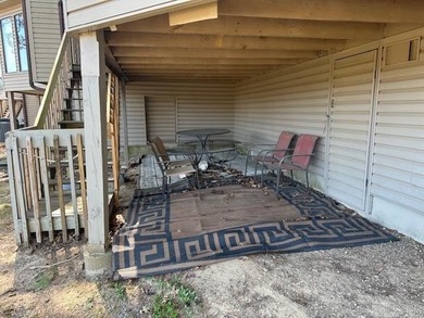 This two-bedroom, two-bathroom condominium, partially furnished on Indian Hills Country Club in Arkansas - for sale on GolfHomes.com, golf home, golf lot