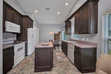 This house with an AMAZING VIEW is PRICED TO SELL in the gated on Kings Gate Golf Club in Florida - for sale on GolfHomes.com, golf home, golf lot