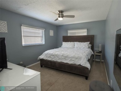 Discover the charm of this inviting single-family home. Located on Crystal Lake Country Club in Florida - for sale on GolfHomes.com, golf home, golf lot
