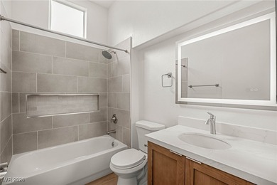 This beautifully updated Sun City Summerlin home has an open on Highland Falls Golf Club in Nevada - for sale on GolfHomes.com, golf home, golf lot