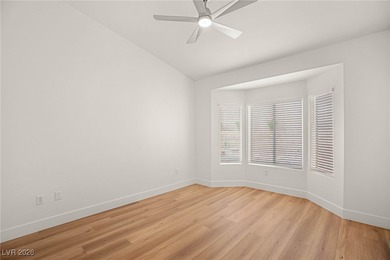 This beautifully updated Sun City Summerlin home has an open on Highland Falls Golf Club in Nevada - for sale on GolfHomes.com, golf home, golf lot