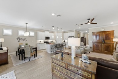 WATER & GOLF VIEWS highlight this beautifully maintained on Herons Glen Golf and Country Club in Florida - for sale on GolfHomes.com, golf home, golf lot