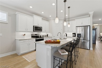 WATER & GOLF VIEWS highlight this beautifully maintained on Herons Glen Golf and Country Club in Florida - for sale on GolfHomes.com, golf home, golf lot