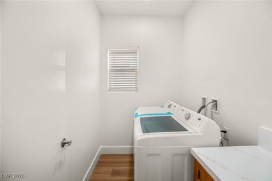 This beautifully updated Sun City Summerlin home has an open on Highland Falls Golf Club in Nevada - for sale on GolfHomes.com, golf home, golf lot