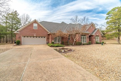 This all-brick, custom-built home sits on a level lot on on Granada Golf Course in Arkansas - for sale on GolfHomes.com, golf home, golf lot