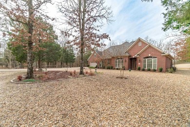 This all-brick, custom-built home sits on a level lot on on Granada Golf Course in Arkansas - for sale on GolfHomes.com, golf home, golf lot