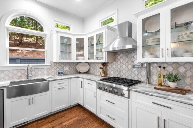 Welcome to Aerie Court, a beautifully remodeled four-sided brick on Cherokee Town and Country Club in Georgia - for sale on GolfHomes.com, golf home, golf lot