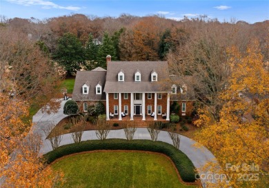 This distinctive home offers six bedrooms and five and a half on Providence Country Club in North Carolina - for sale on GolfHomes.com, golf home, golf lot