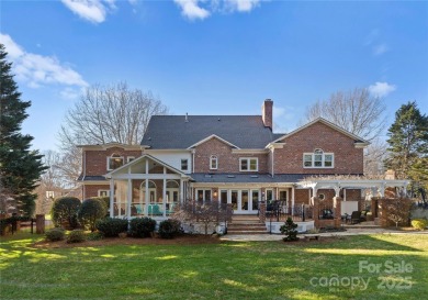 This distinctive home offers six bedrooms and five and a half on Providence Country Club in North Carolina - for sale on GolfHomes.com, golf home, golf lot