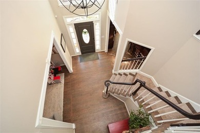 Imagine pulling into the driveway of a stunning traditional on Canongate At Eagle Watch Golf Club in Georgia - for sale on GolfHomes.com, golf home, golf lot