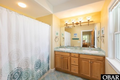 Coastal elegance meets timeless craftsmanship in Kitty Hawk, NC! on Seascape Golf Links in North Carolina - for sale on GolfHomes.com, golf home, golf lot