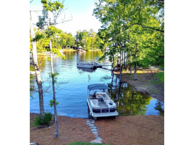 Welcome Home to 125 Bay Pointe Drive. Enjoy serene lake living on Timberlake Country Club in South Carolina - for sale on GolfHomes.com, golf home, golf lot