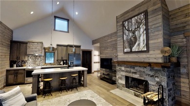 This pristine Montana cabin is situated on a quiet side street on Wilderness Club in Montana - for sale on GolfHomes.com, golf home, golf lot