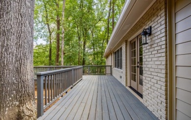 Stunning home with a rocking chair front porch on a friendly on Bobby Jones Golf Club in Georgia - for sale on GolfHomes.com, golf home, golf lot