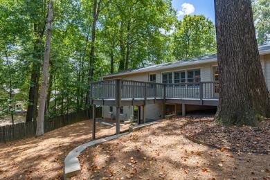 Stunning home with a rocking chair front porch on a friendly on Bobby Jones Golf Club in Georgia - for sale on GolfHomes.com, golf home, golf lot