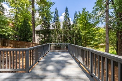 Stunning home with a rocking chair front porch on a friendly on Bobby Jones Golf Club in Georgia - for sale on GolfHomes.com, golf home, golf lot