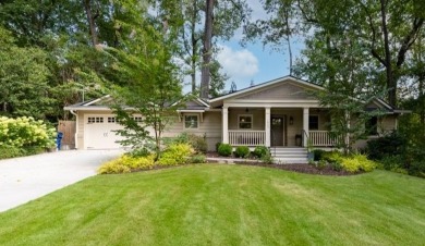 Stunning home with a rocking chair front porch on a friendly on Bobby Jones Golf Club in Georgia - for sale on GolfHomes.com, golf home, golf lot