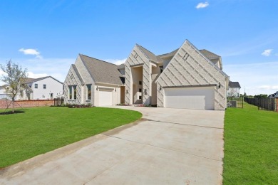 Move-in Ready! Nestled in the popular Heath Golf and Yacht Club on Heath Golf and Yacht Club in Texas - for sale on GolfHomes.com, golf home, golf lot