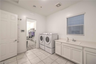 Experience unparalleled luxury and serenity in this contemporary on Reflection Bay Golf Club in Nevada - for sale on GolfHomes.com, golf home, golf lot