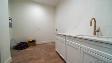 The nicest home in the most upscale subdivision at the LOZ! This on The Oaks Golf Course in Missouri - for sale on GolfHomes.com, golf home, golf lot