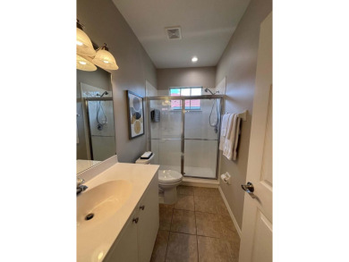 Lovely unfurnished second-floor unit at Flamingo Fairways in on Lely Resort Golf and Country Club in Florida - for sale on GolfHomes.com, golf home, golf lot