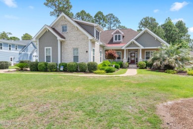 Discover this stunning 4-bedroom, 3-bath custom Craftsman home on Carolina National Golf Club in North Carolina - for sale on GolfHomes.com, golf home, golf lot