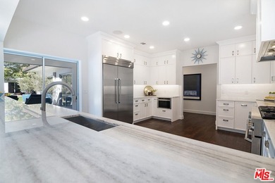 Extensively renovated and expanded Mediterranean home on Wilshire Country Club in California - for sale on GolfHomes.com, golf home, golf lot