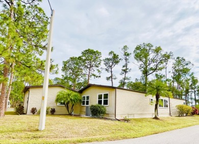 This spacious three-bedroom, two-bathroom home is located in the on Pine Lakes Country Club in Florida - for sale on GolfHomes.com, golf home, golf lot