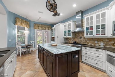 The 3 bedroom 3.5 bathroom home has a beautiful front elevation on Verandah Golf Course and Club in Florida - for sale on GolfHomes.com, golf home, golf lot