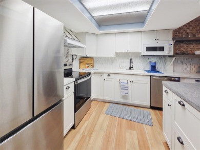 Beautifully Updated 1st-Floor Condo with Golf, Lake & Greenway on Country Club At Silver Springs Shores in Florida - for sale on GolfHomes.com, golf home, golf lot