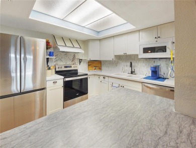 Beautifully Updated 1st-Floor Condo with Golf, Lake & Greenway on Country Club At Silver Springs Shores in Florida - for sale on GolfHomes.com, golf home, golf lot