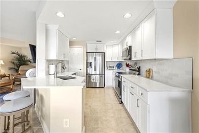 STUNNING FIRST FLOOR UNIT, WITH LONG LAKE VIEWS in Harbor on Bonita Bay West in Florida - for sale on GolfHomes.com, golf home, golf lot