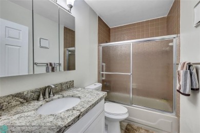 This Charming completely Renovated town home with IMPACT WINDOW on Jacaranda Golf Club in Florida - for sale on GolfHomes.com, golf home, golf lot