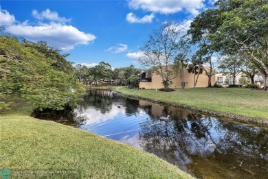 This Charming completely Renovated town home with IMPACT WINDOW on Jacaranda Golf Club in Florida - for sale on GolfHomes.com, golf home, golf lot