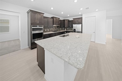 Stunning, newer-built Hawthorn model home in Calesa Township! on Stone Creek Golf Club in Florida - for sale on GolfHomes.com, golf home, golf lot