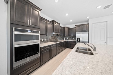 Stunning, newer-built Hawthorn model home in Calesa Township! on Stone Creek Golf Club in Florida - for sale on GolfHomes.com, golf home, golf lot