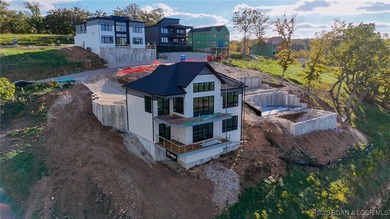 Amazing New Waterfront Home built by Thomas Construction in on The Oaks Golf Course in Missouri - for sale on GolfHomes.com, golf home, golf lot