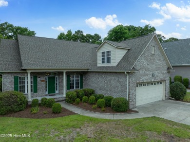 Nestled in a quiet cul-de-sac and backed by a serene pond shaded on Members Club At St. James Plantation in North Carolina - for sale on GolfHomes.com, golf home, golf lot