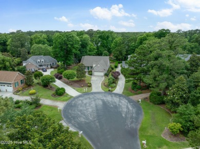 Nestled in a quiet cul-de-sac and backed by a serene pond shaded on Members Club At St. James Plantation in North Carolina - for sale on GolfHomes.com, golf home, golf lot