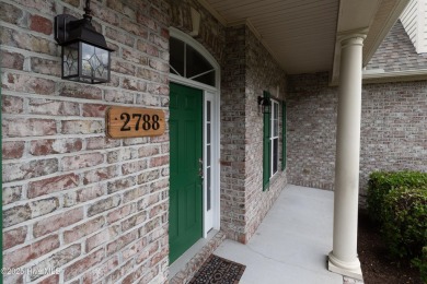 Nestled in a quiet cul-de-sac and backed by a serene pond shaded on Members Club At St. James Plantation in North Carolina - for sale on GolfHomes.com, golf home, golf lot